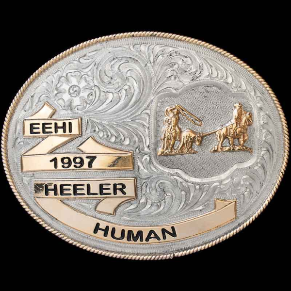 The Rogersville Belt Buckle exudes western class & elegance. This shiny silver belt buckle features detaitled bronze banners and a hand engraved base. Personalize this belt buckle now!